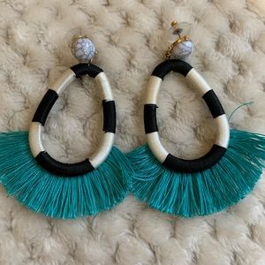 Dangle earring with teal tassel